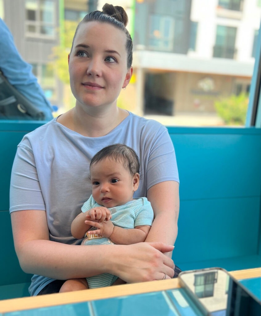Older First Time Mom with newborn at a restaurant. 
