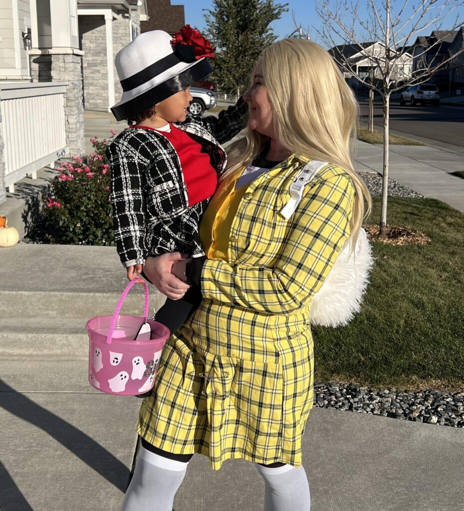 Mommy and me Cher and Dionne Halloween costume with mom in yellow plaid and toddler in a tweed jacket and hat
